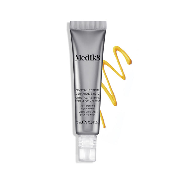 Tuba krému Medik8 Crystal Retinal Ceramide Eye 10 vedľa cikcak prúžku žltého krému na bielom pozadí.-hover-8